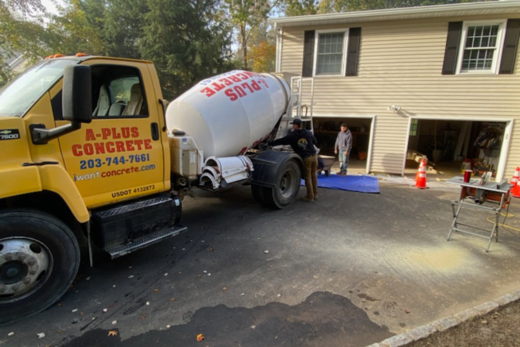 A Plus Concrete | Ready to Mix Concrete Delivery in Western CT | Pouring concrete on driveway